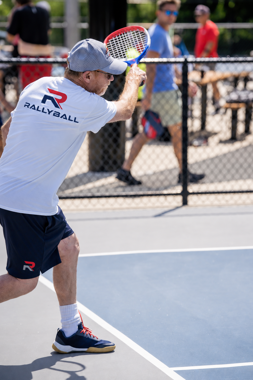 RALLYBALL player striking an overhead shot